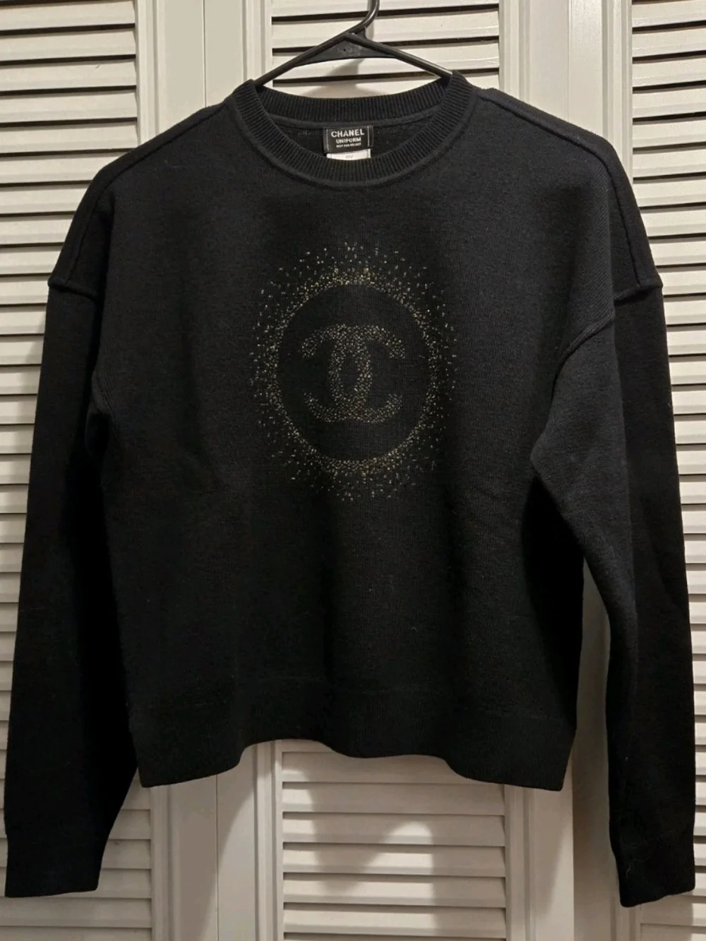 CHANEL Uniform Black Crewneck Sweater with Gold CC Sunburst